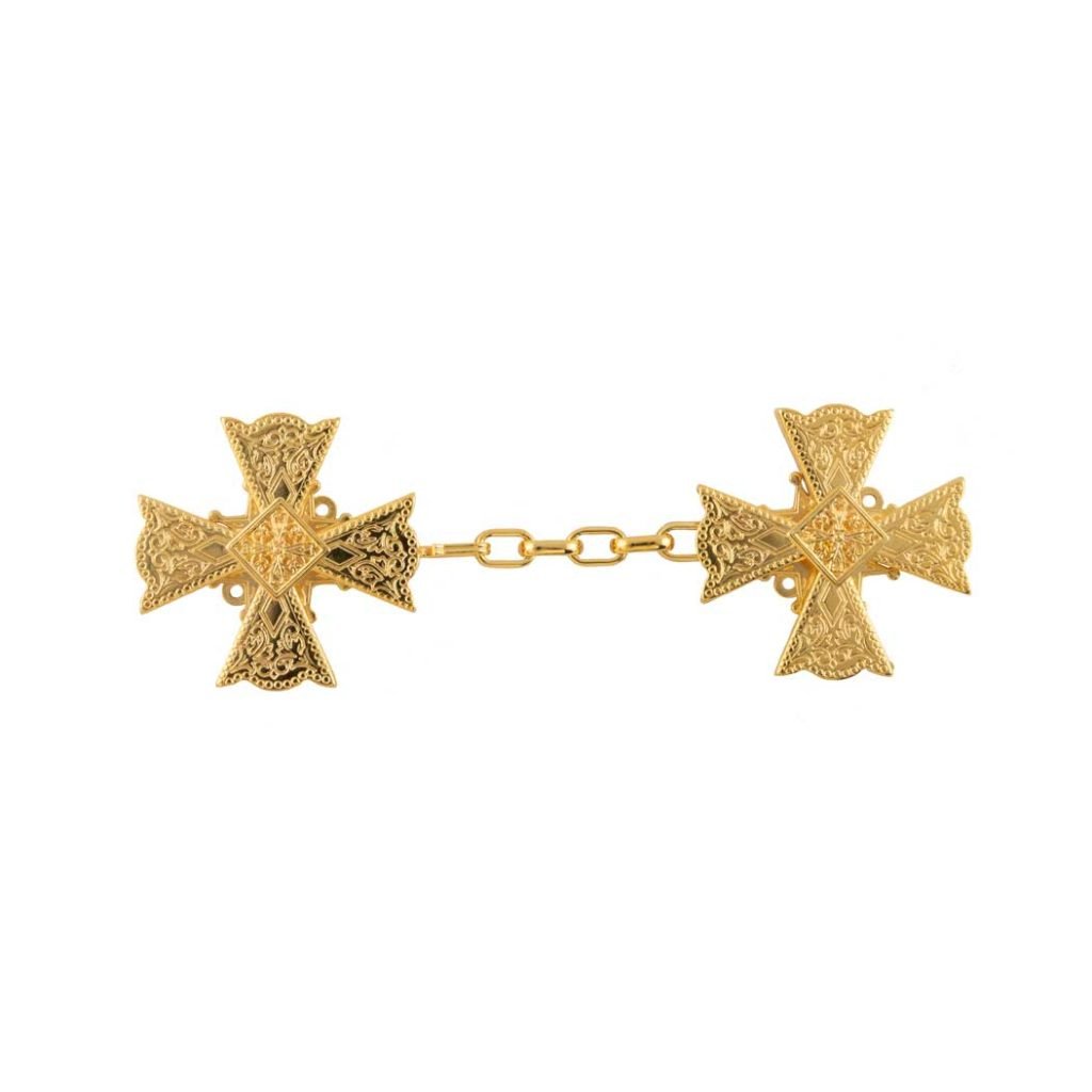 Il Gancio per Piviale Croce di Malta è caratterizzato da spille decorative in oro collegate da una catena corta, su sfondo bianco.