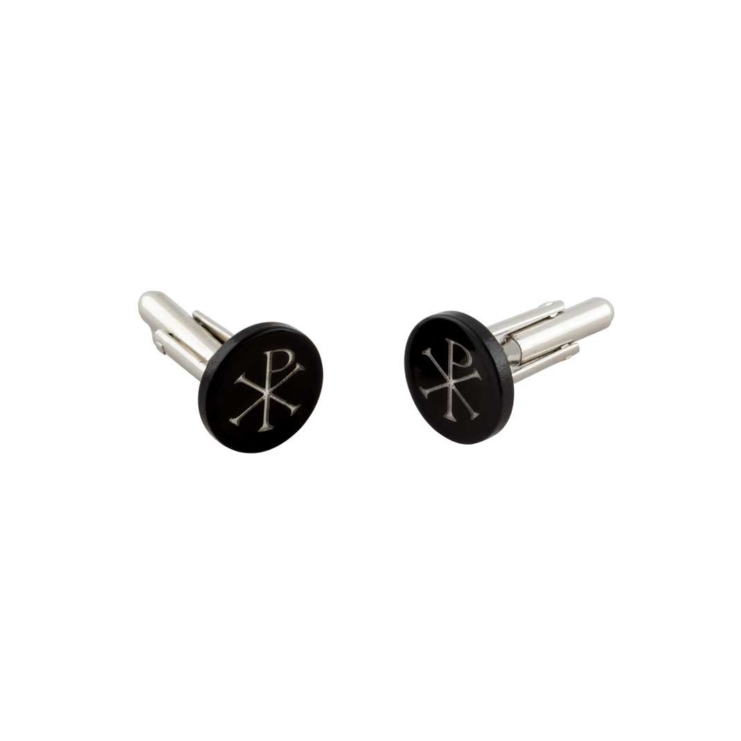 Gemelli da polso con Chi Rho: Coppia di gemelli rotondi con simbolo Chi Rho in argento su sfondo nero.